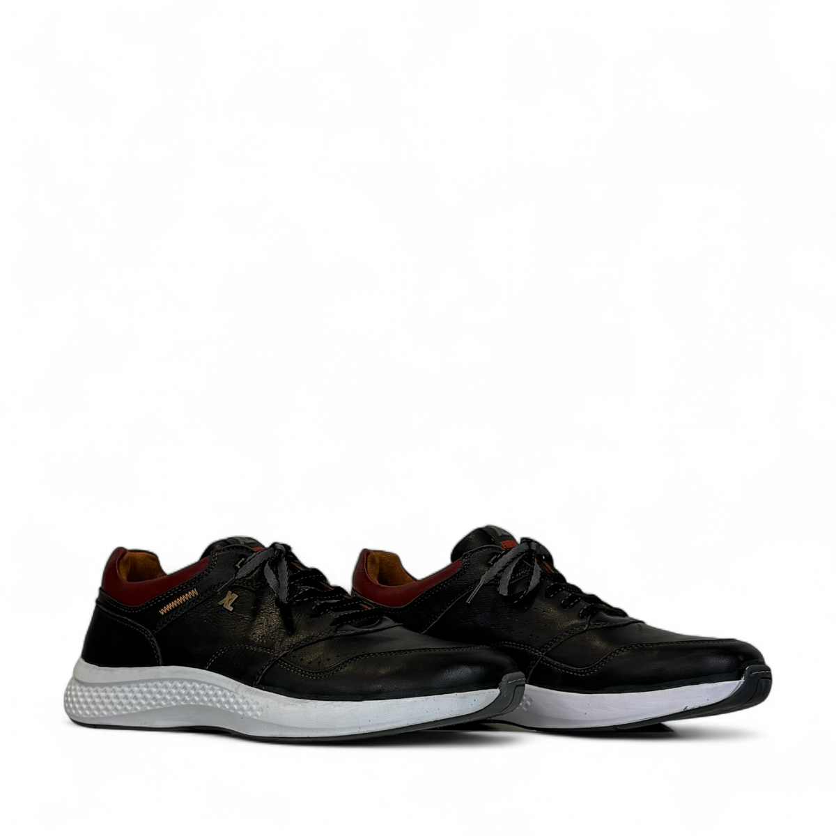 XL EVER LIFE HANNA black leather sneaker with a white textured sole and maroon heel detail. Photo of side views.